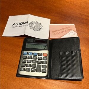 4 1/2 inch calculator with pocket for business cards Black vinyl cover